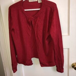 Vintage Penman’s size large sweater with sequins adorning it, buttons down front